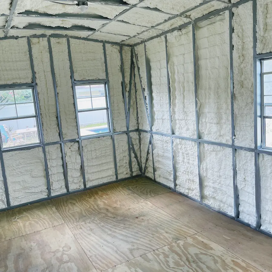 Closed-cell spray foam insulation applied to wall cavities in a residential project in Antigo